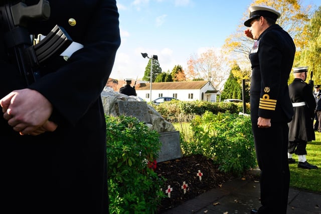 Captain Davey laying a wreath.