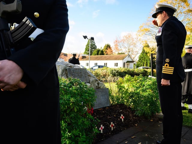Captain Davey laying a wreath.
