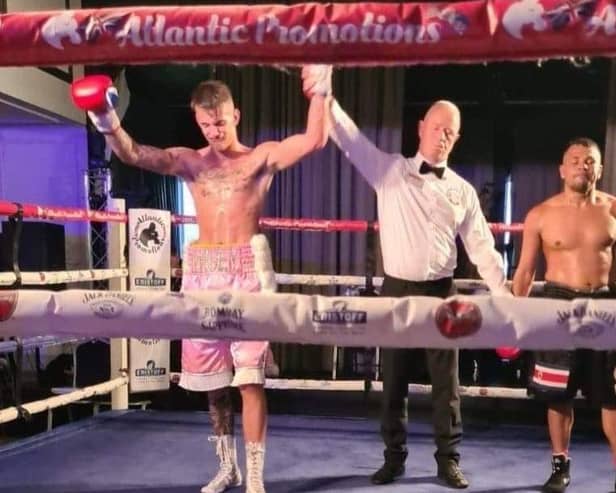 Liam Wiseman is declared the points winner against Berman Sanchez and has his had raised on South Parade Pier
