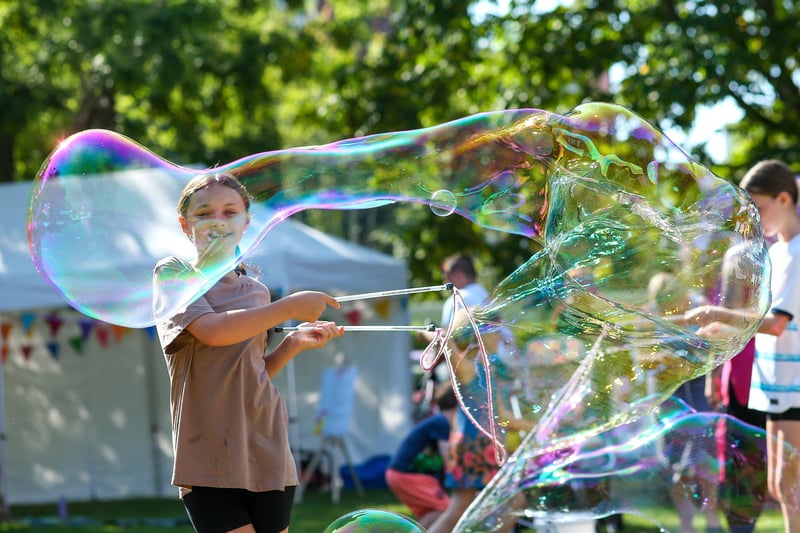 Isabella, 11, has fun making a giant soap bubble at a Suicide awareness event in Victoria Park, Portsmouth
Picture: Chris Moorhouse (jpns 090923-06)