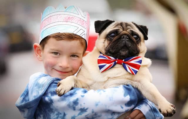 Hugo Fleming, six, and his dog Albert at the Meon Road street party for King Charles III's coronation (jpns 060523-17)