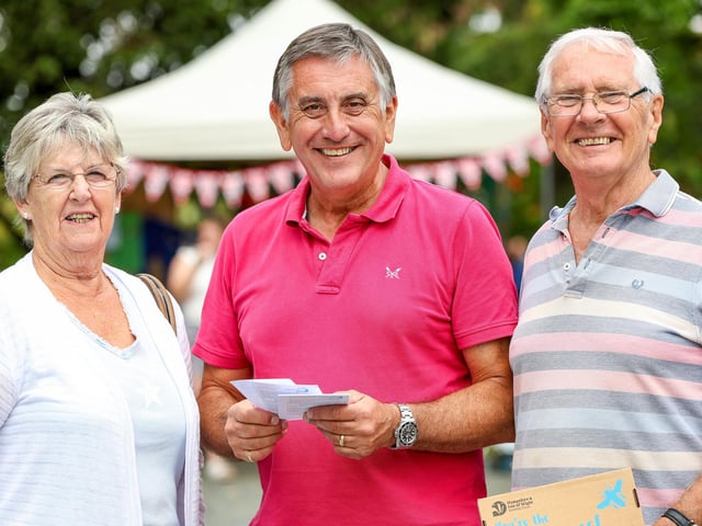 (l-r) Moira Dowson, Wayne Crowther and Harry Dowson, of Denmead Communicare at the Denmead Horticultural Society's 74th Village Show. Picture: Chris Moorhouse (160825-35)