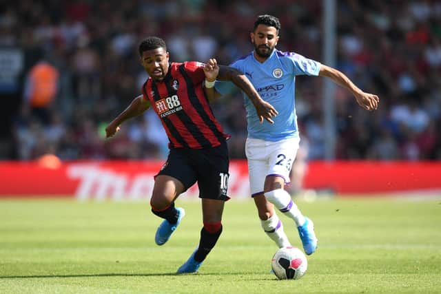 Jordon Ibe battles for possession with Manchester City's Riyad Mahrez last August. Now the Cherries winger could be set to face Moneyfields in the Hampshire Senior Cup. Photo by Shaun Botterill/Getty Images.