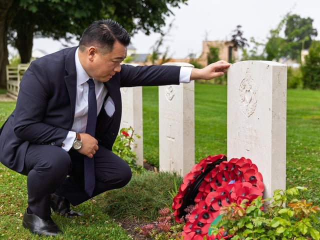 Alan Mak MP at the grave of Captain Charles Pring from Havant in Bayeux War Cemetery