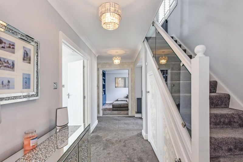 The Zoopla listing says: 'The property is accessed by a pair of gates, the large driveway providing ample off road parking. Internally you are welcomed into a large entrance hallway which has stairs which lead to the upper floors and doors access all principle room."