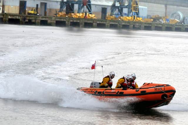 Portsmouth's lifeboat was launched last night after reports of two 'inappropriately dressed' paddle boarders getting into difficulty.