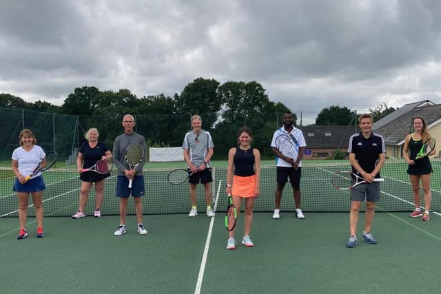 Active Academy and Rowlands Castle's mixed teams line up in front of the net, from left to right: Lynne Foster, Dawn Wears, Matt Bennett, John Marenghi, Sophie Grist, Don Iro, Matt Grigg, Rachel Heda