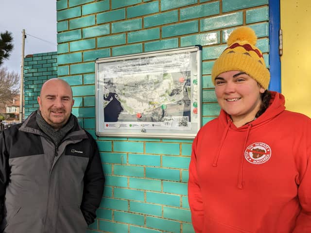 Councillor Steve Pitt and Sarah Shreeve with a stormwater release sign. Picture: Portsmouth City Council.