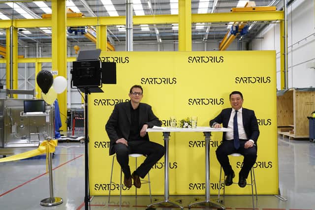 Left, Matt Bylett with Alan Mak at the Sartorius site.
