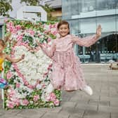 Children enjoying the flower installations at Whiteley Shopping Centre in Fareham