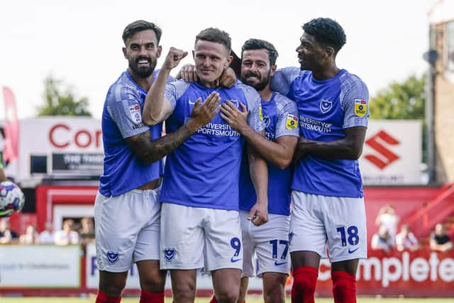 Colby Bishop, centre, celebrated his second goal at Cheltenham with Marlon Pack, Joe Rafferty and Reeco Hackett Picture: Jason Brown