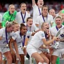 The England team lifting the UEFA Women's EURO 2022 Trophy (Photo by Naomi Baker/Getty Images)