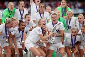 The England team lifting the UEFA Women's EURO 2022 Trophy (Photo by Naomi Baker/Getty Images)