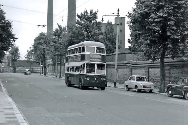 Seen in St George’s Road is the trolly bus on route 6 to the Dockyard. To the rear are the towering chimneys of the power station in Gunwharf Road.