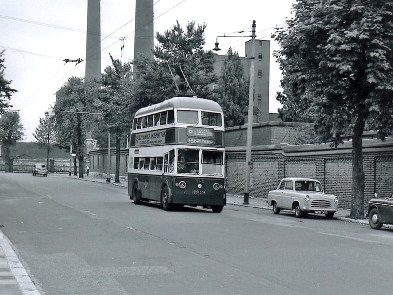 Seen in St George’s Road is the trolly bus on route 6 to the Dockyard. To the rear are the towering chimneys of the power station in Gunwharf Road.