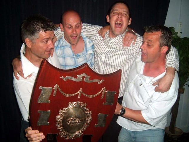 Stoke B celebrate winning the league title. From left: Roger May, Tony Brown, Dave Coombs, and Joe Booker from Stoke B celebrate winning the title