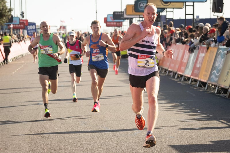 Pictured is: Runners cross the line to finish