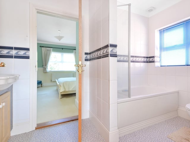 This four bedroom detached family home is on the market at a guide price of £950,000. It is listed by Fine and Country.