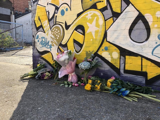 Flowers and cards left in memory of Lorraine Bream, who was found dead on rooftop.