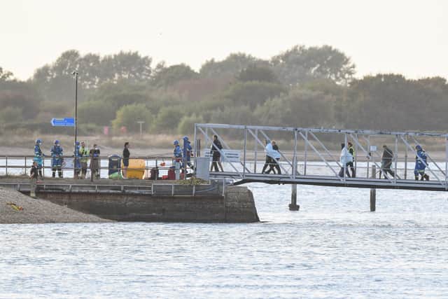 Around 140 migrants arrive in Portsmouth after being transferred from a single dingy south of the Isle of Wight in the English Channel by two RNLI lifeboats