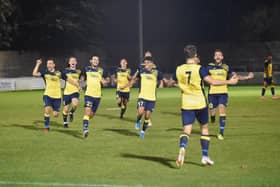 Moneyfields players rush to congratulate Joe Briggs (7) after the latter's winning penalty in the shoot-out at Aylesbury United. Pic: Michael Snell.