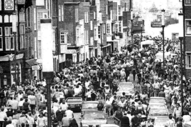 Thousands gathered in Old Portsmouth to greet the homecoming of HMS Hermes from the Falklands, 1982.