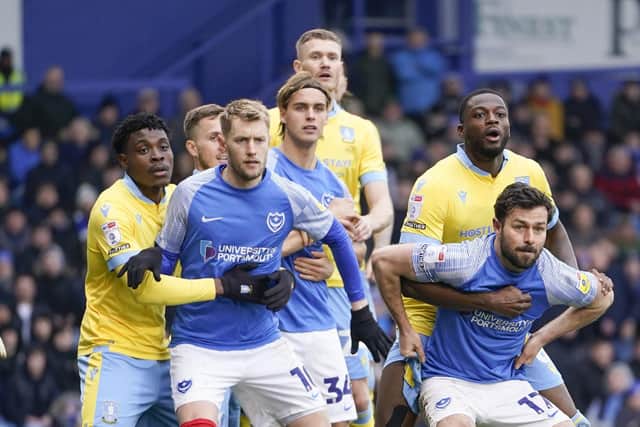 Pompey duo Joe Pigott and Joe Rafferty are tightly marked by the Sheffield Wednesday defence during Saturday's game at Fratton Park