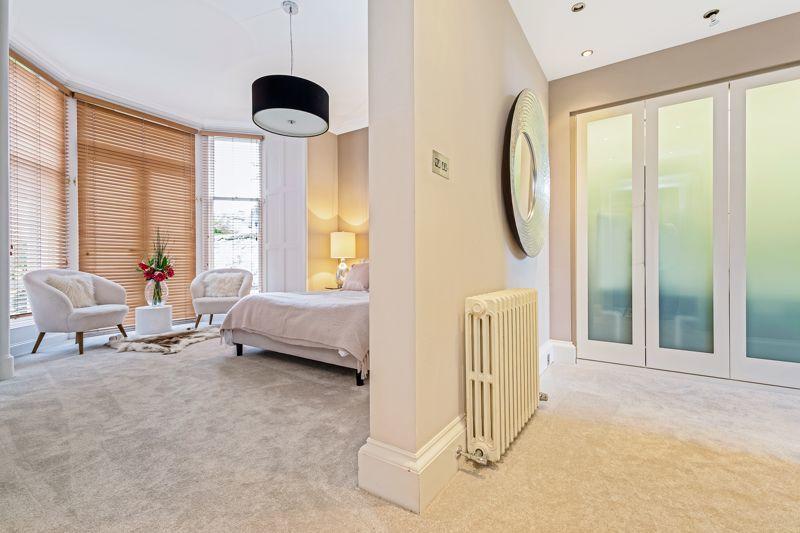 Master bedroom with dressing area.