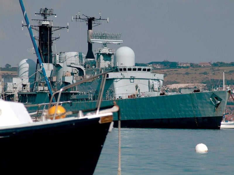 HMS Cardiff with Portchester shore behind. Picture: Trevor Evans, © Hampshire County Council Museum Service.
