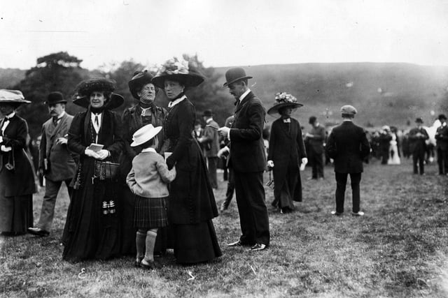 1910:  A scene at Goodwood, with Leo Rothschild and Lady Marsh on the right.  (Photo by W. G. Phillips/Phillips/Getty Images)