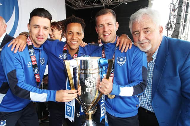 From left: Enda Stevens, Kyle Bennett,  Michael Doyle, and former chairman Iain McInnes celebrate Pompey's League Two title success. Picture: Joe Pepler