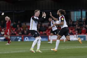 Marcus Harness celebrates with Ronan Curtis after netting Pompey's late leveller at Accrington. Picture: Daniel Chesterton/phcimages.com