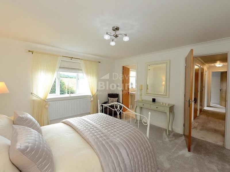 The second double bedroom is also spacious and bright. It includes three sets of fitted double wardrobes.