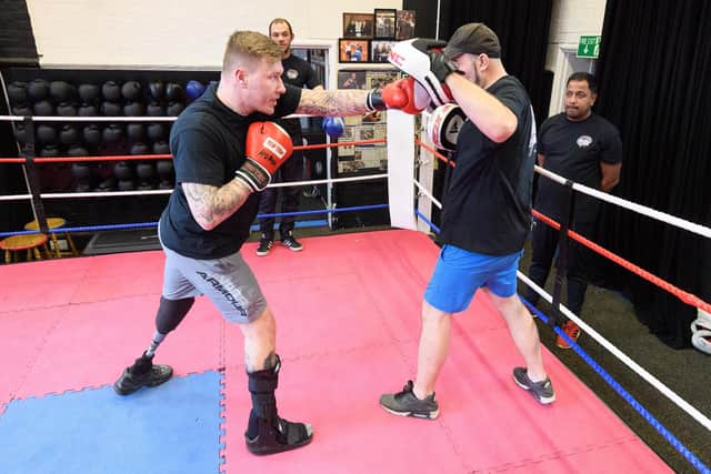 Matt Edwards working on some pad drills with Johny Byng. Picture: Keith Woodland (120420-109)