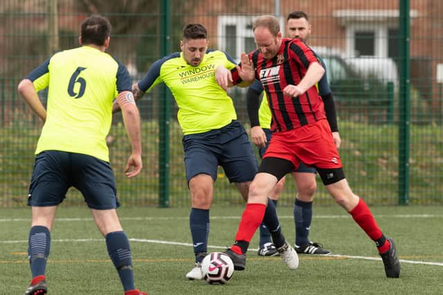 Horndean (red/black) v Harvest in Mid-Solent League action in 2019/20. Picture: Keith Woodland
