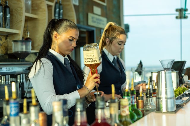 Bar staff preparing drinks for the Sky Bar's first guests.