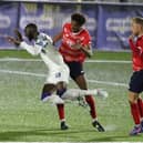 Mo Faal is sent tumbling following a  Sido Jombati challenge, but Hawks' shouts for a penalty were waved away. Picture by Dave Haines