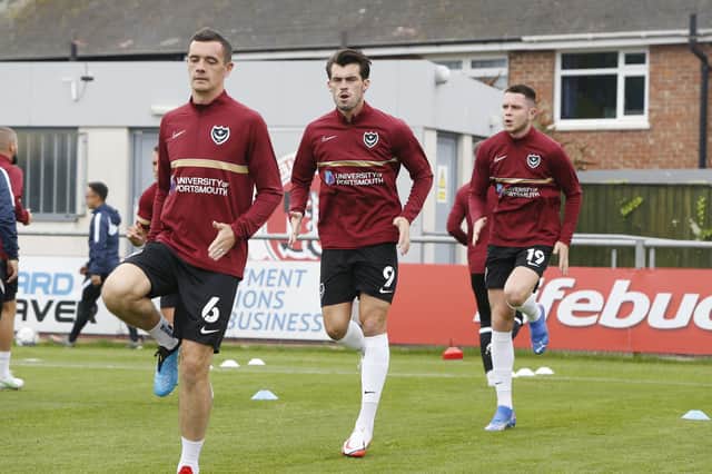 Shaun Williams, left, warms up at Fleetwood, yet had to soon pull out before kick-off with a stiff back. Picture: Paul Thompson/ProSportsImages