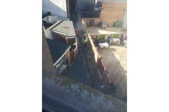 Police in an alleyway between Fisherman's Kitchen and Riva 6 beauty on Clarendon Road Southsea after a woman was raped. 

Picture Lewis Bishop.