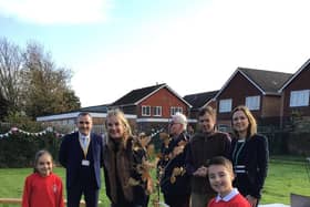 Staff and pupils at Alverstoke Church of England Junior School celebrate their connection with, Kitoo Primary School with a tree planting ceremony on Friday 2 December, joined by Gosport MP Dame Caroline Dinenage.
