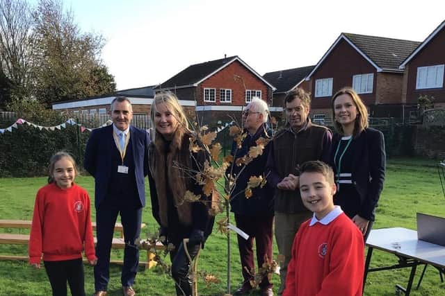 Staff and pupils at Alverstoke Church of England Junior School celebrate their connection with, Kitoo Primary School with a tree planting ceremony on Friday 2 December, joined by Gosport MP Dame Caroline Dinenage.