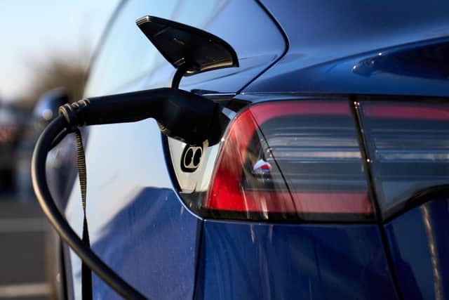 A Tesla electric car being charged