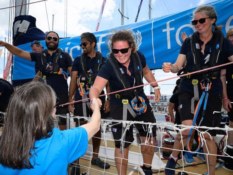 Crew members hug and greet family and friends.Picture: Keith Woodland (270721-19)