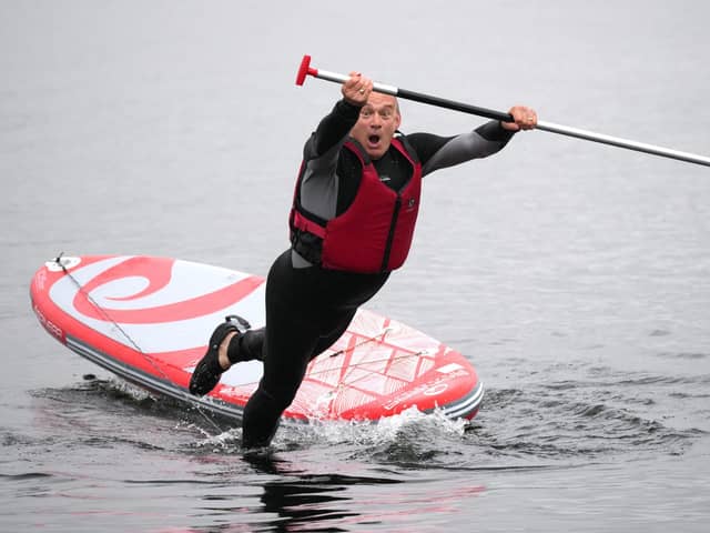Lib Dem leader Sir Ed Davey falls into lake.