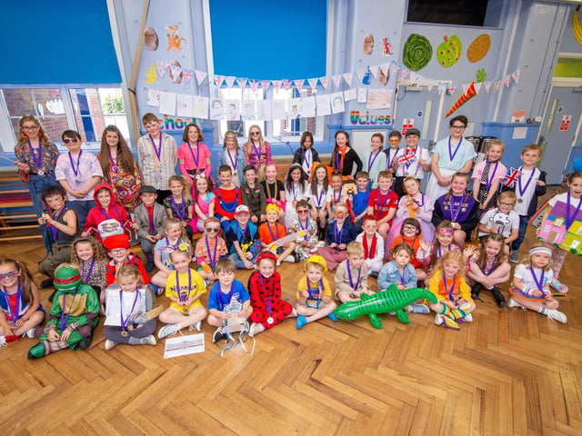 Pupils of Kings Academy Junior School, Crofton Road, Portsmouth celebrating in their school hall