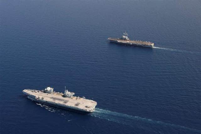 HMS Queen Elizabeth pictured with French aircraft carrier FS Charles de Gauelle during an operation in the Mediterranean. Photo: Royal Navy