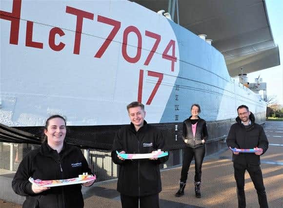 Miniature models will be on display at the museum until next Tuesday. L-R: D-Day Story museum and visitor service officers Lorna Street and Max Butcher; artist Jan Frith; general manager Ross Fairbrother. Picture: The D-Day Story/Portsmouth City Council.