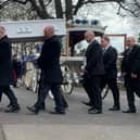 Ace Rewcastle's coffin is carried into St Mary's Church in Fratton today 
Picture: Sarah Standing