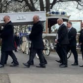 Ace Rewcastle's coffin is carried into St Mary's Church in Fratton today 
Picture: Sarah Standing