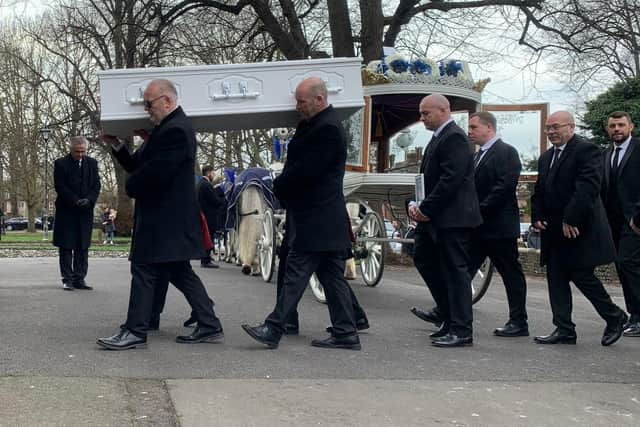 Ace Rewcastle's coffin is carried into St Mary's Church in Fratton today 
Picture: Sarah Standing